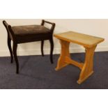 EDWARDIAN MAHOGANY PIANO STOOL with shaped side handles and a needle point lift up seat, standing on