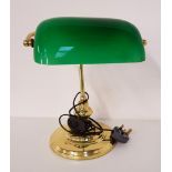 VINTAGE STYLE DESK LAMP raised on brass circular base with a shaped brass column and a green glass