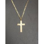 NINE CARAT GOLD CROSS PENDANT ON FOURTEEN CARAT GOLD CHAIN the cross 3.2cm high including suspension