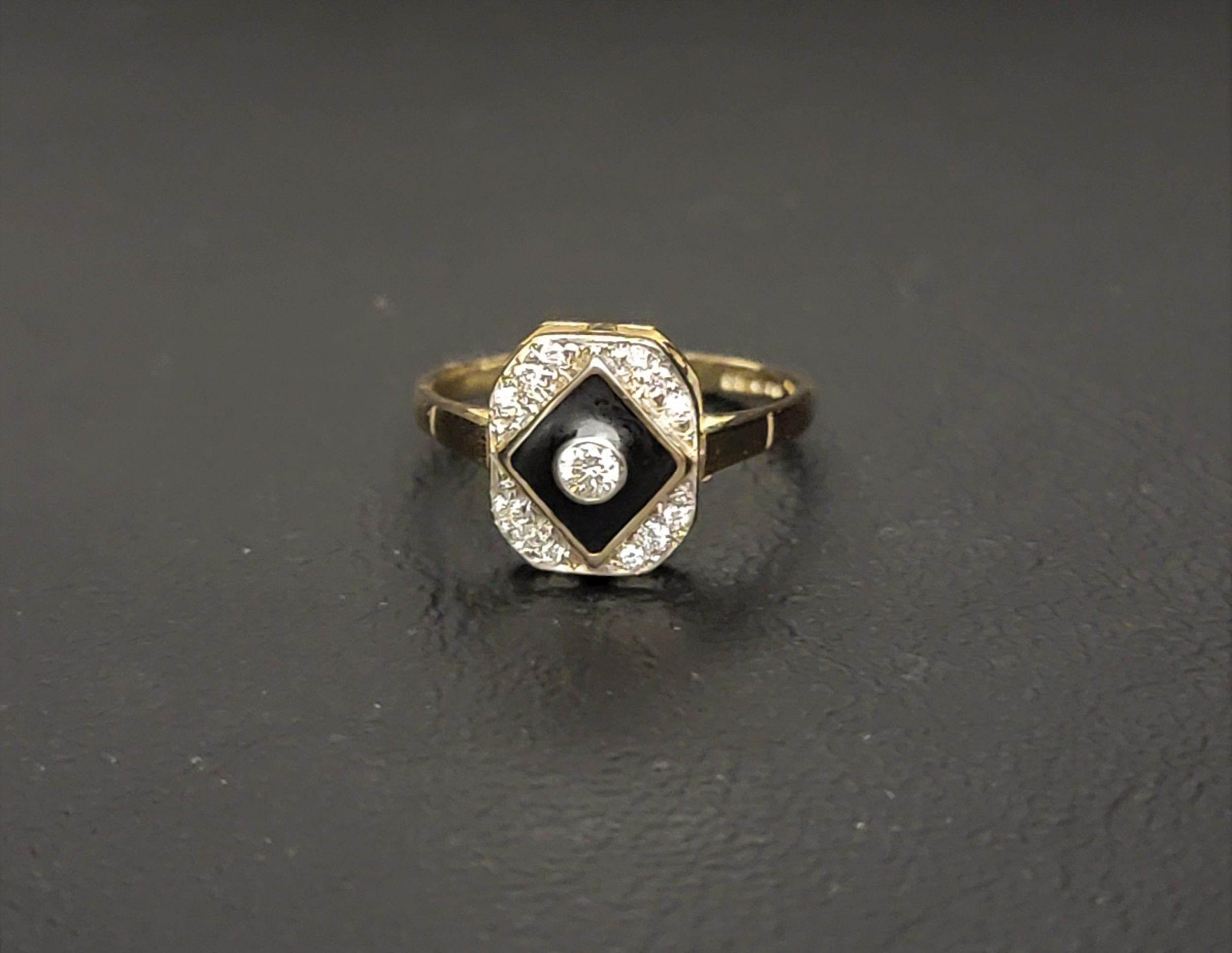 ART DECO STYLE ENAMEL AND DIAMOND RING the central bezel set diamond approximately 0.07cts in a