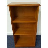 TEAK BOOKCASE with a moulded top above two adjustable shelves, standing on a plinth base, 92cm high