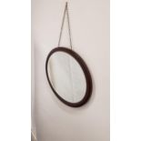 MAHOGANY OVAL WALL MIRROR with a bevelled plate, 67cm wide