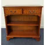 MAHOGANY AND CROSSBANDED SIDE CABINET with a moulded top above two frieze drawers with an adjustable