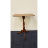 19th CENTURY MAHOGANY OCCASIONAL TABLE the rectangular top with canted corners, standing on a turned