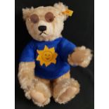 STEIFF SUMMER GROWLER TEDDY BEAR numbered 654473, wearing sunglasses a blue T shirt with the sun,