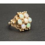 IMPRESSIVE OPAL CLUSTER RING the seven round cabochon opals in moulded setting with ball detail,