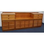 NATHAN TEAK SIDEBOARD with a central recess flanked by two pairs of drawers above three lower