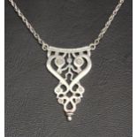 OLA GORIE SILVER PENDANT ON CHAIN the pierced pendant with stick figure surrounded by scrolling