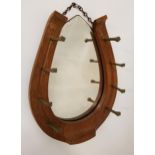 19th CENTURY OAK HORSE SHOE MIRROR with a shaped bevelled plate, the horse shoe frame with eight