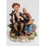 ROYAL MERIDIAN NORITAKE FIGURINE depicting an old couple sat on a park bench, 24cm high