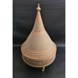 LARGE BRASS TAGINE the conical lid with embossed decoration, the circular base on three turned brass