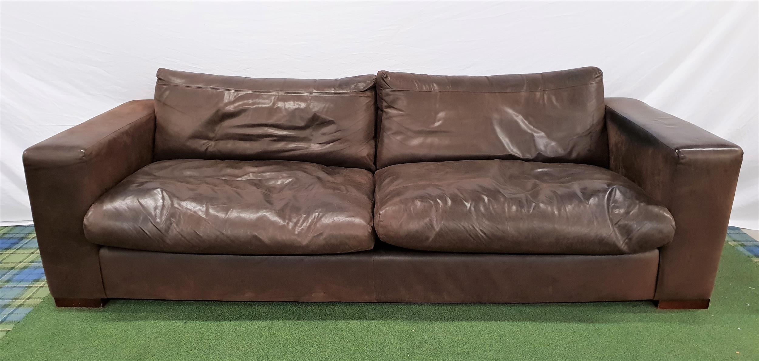 LARGE LEATHER SOFA covered in chocolate brown leather with loose back and seat cushions and