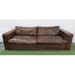 LARGE LEATHER SOFA covered in chocolate brown leather with loose back and seat cushions and