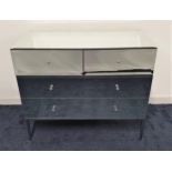 LARGE MIRRORED CHEST OF DRAWERS with a bevelled top above two short and two long drawers, standing