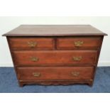 EDWARDIAN OAK CHEST OF DRAWERS with a moulded top above two panelled frieze drawers and two panelled