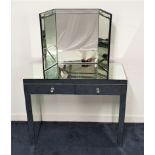 MIRRORED KNEEHOLE DRESSING TABLE with a bevelled top above two frieze drawers, 82cm x 101cm,