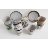 SELECTION OF HIGHLAND STONEWARE including six beakers, five mugs, four saucers and a lidded sugar