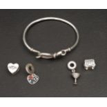 SELECTION OF PANDORA JEWELLERY comprising an Infinity Knot Bangle, a Pave Cocktail Glass Dangle