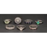SELECTION OF SEVEN GEM SET RINGS the rings of varying designs including half-infinity bands, cluster
