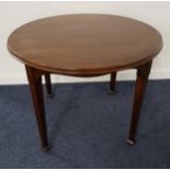 WYLIE & LOCHHEAD MAHOGANY HALL TABLE with a circular top above an arched frieze, standing on squared