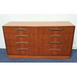 G PLAN FRESCO TEAK CHEST OF DRAWERS with a moulded top above eight drawers with roll over handles,
