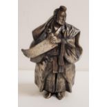 JAPANESE SILVERED BRONZE OF A SHINTO PRIEST wearing flowing robes and holding a scroll, with