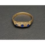 GRADUATED SAPPHIRE AND DIAMOND FIVE STONE RING on eighteen carat gold shank, ring size T and