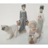 FOUR LLADRO FIGURINES Eskimo playing with a polar bear cub 1195, 12.5cm high, Attentive polar bear