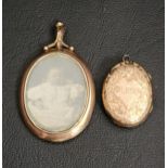 TWO GOLD LOCKET PENDANTS one in nine carat gold with glazed panel to the front; the other an
