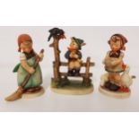 THREE GOEBEL FIGURINES depicting a girl feeding geese, 12cm high, girl with a broom, 12cm high,