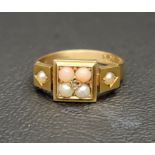 CORAL AND SEED PEARL DRESS RING in eighteen carat gold, ring size J-K and approximately 3.1 grams