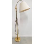 BRASS STANDARD LAMP raised on a circular base with a turned column and a shaped and height