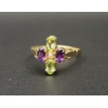 UNUSUAL 'SUFFRAGETTE' RING the oval cut amethysts and peridots around a central seed pearl
