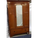 EDWARDIAN MAHOGANY AND INLAID WARDROBE with a moulded cornice above a central bevelled mirror door