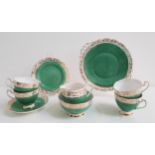 ROSLYN CHINA TEA SET decorated with a mottled green ground with a gilt border, comprising eleven