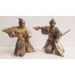 PAIR OF JAPANESE STAINLESS STEEL FIGURE OF A SAMURAI wearing kimonos and holding bowls in their