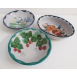 THREE HIGHLAND STONEWARE BOWLS two round bowls decorated with strawberries, the other with