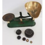 J & J SIDDON SHOP SCALES with green painted body, a circular weight platform and a shaped brass