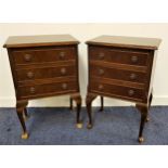 PAIR OF FIGURED WALNUT BEDSIDE CHESTS with a moulded top with canted corners above three drawers,