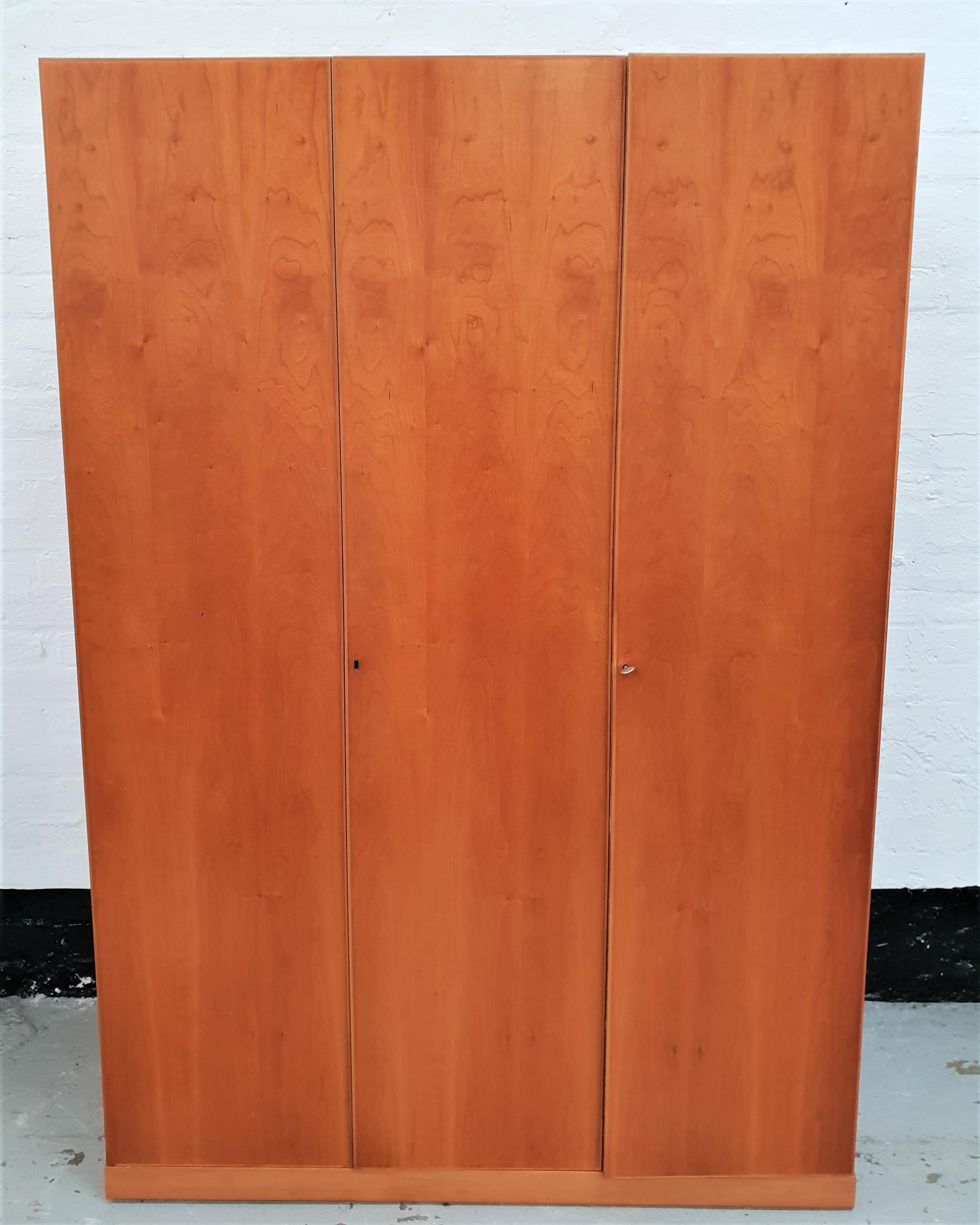 LARGE WHITE & NEWTON CHERRY WARDROBE with three doors opening to reveal a shelf and hanging space,