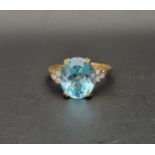 BLUE TOPAZ AND DIAMOND DRESS RING the oval cut blue topaz measuring approximately 11.7mm x 9.8mm x