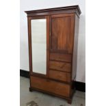 VICTORIAN MAHOGANY WARDROBE with a moulded pediment above a single mirrored door and a panelled