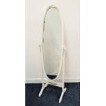 OVAL CHEVAL MIRROR with a plain plate, standing on shaped supports, 148cm high