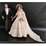 TWO FRANKLIN MINT HEIRLOOM DOLLS of John F Kennedy as the groom and Jacqueline Kennedy as the bride,