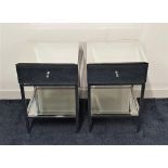 PAIR OF MIRRORED BEDSIDE TABLES with bevelled tops above a frieze drawer with a shelf below,