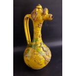 19th CENTURY CANNAKALE POTTERY EWER decorated with a yellow and green glaze and applied flowers,