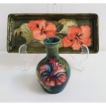 MOORCROFT POTTERY PEN TRAY decorated with a green ground and hibiscus flowers, 20.5cm long, together