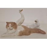 THREE NAO FIGURINES comprising a recumbent cat, 26cm long, goose, 15cm high, and a duck, 8cm high (