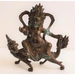 BRONZE TIBETAN FIGURE OF MAHAKALA riding a mythical beast, 20.5cm high