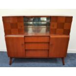 BEAUTILITY MAHOGANY DRINKS CABINET with a bow front above a pair of central glass sliding doors with